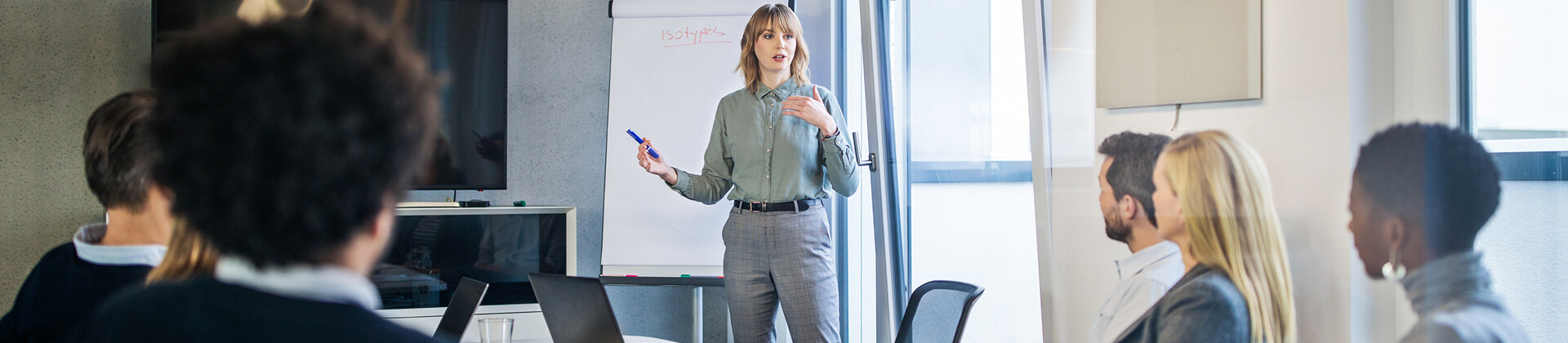 Woman teaches a group of adult students