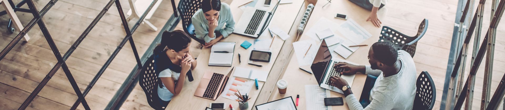 Master of Arts in Human Behavior Psychology - people working around a desk