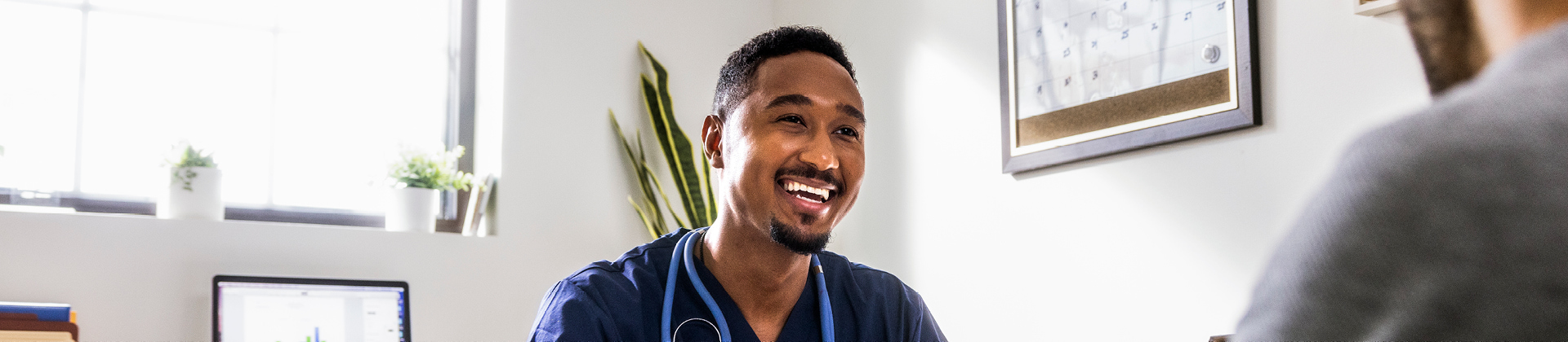 doctor talking with patient in office